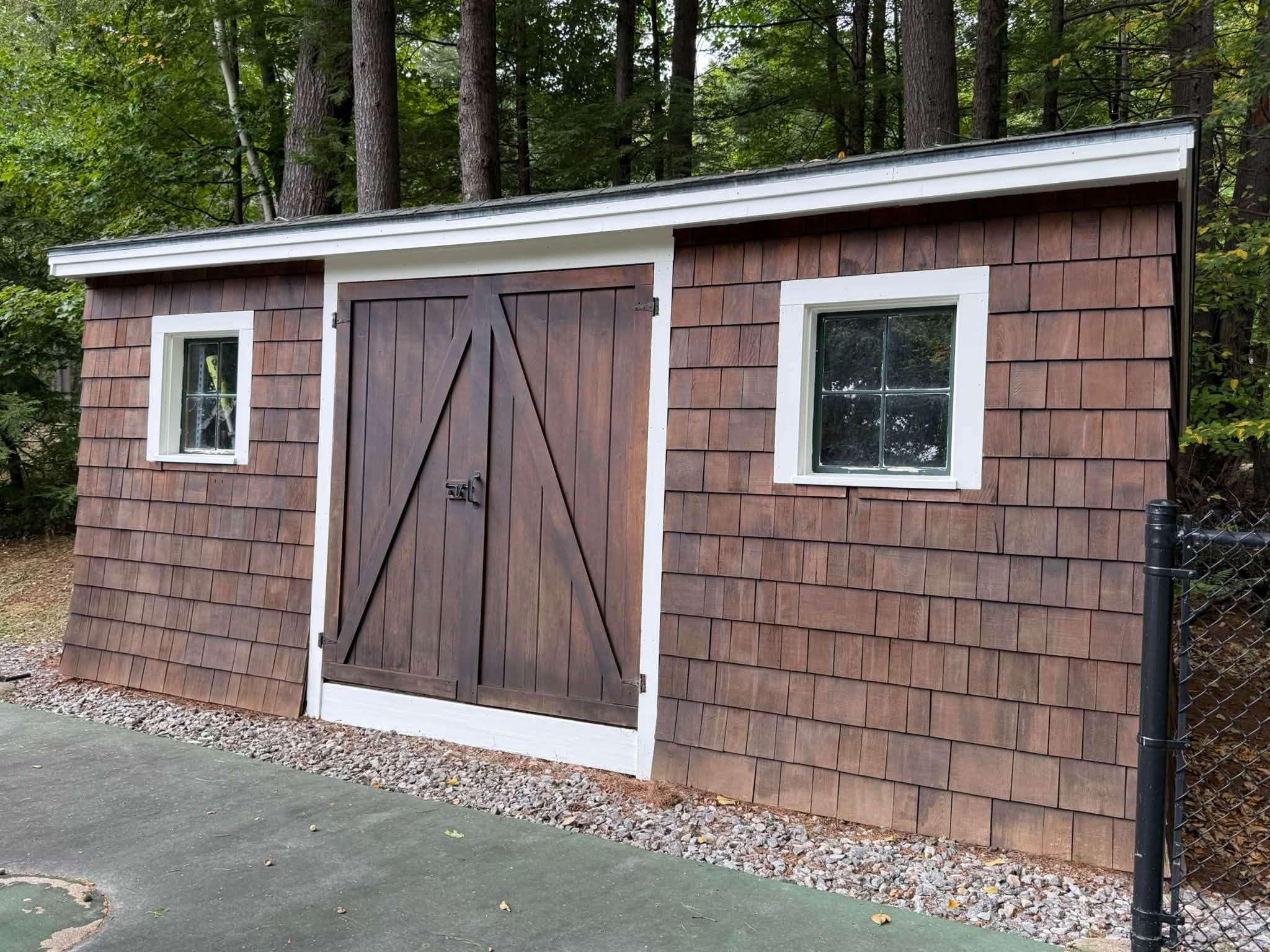 Lakefront Cedar Shingle Restoration — Walnut Stain, Trim & Railings — photo 9
