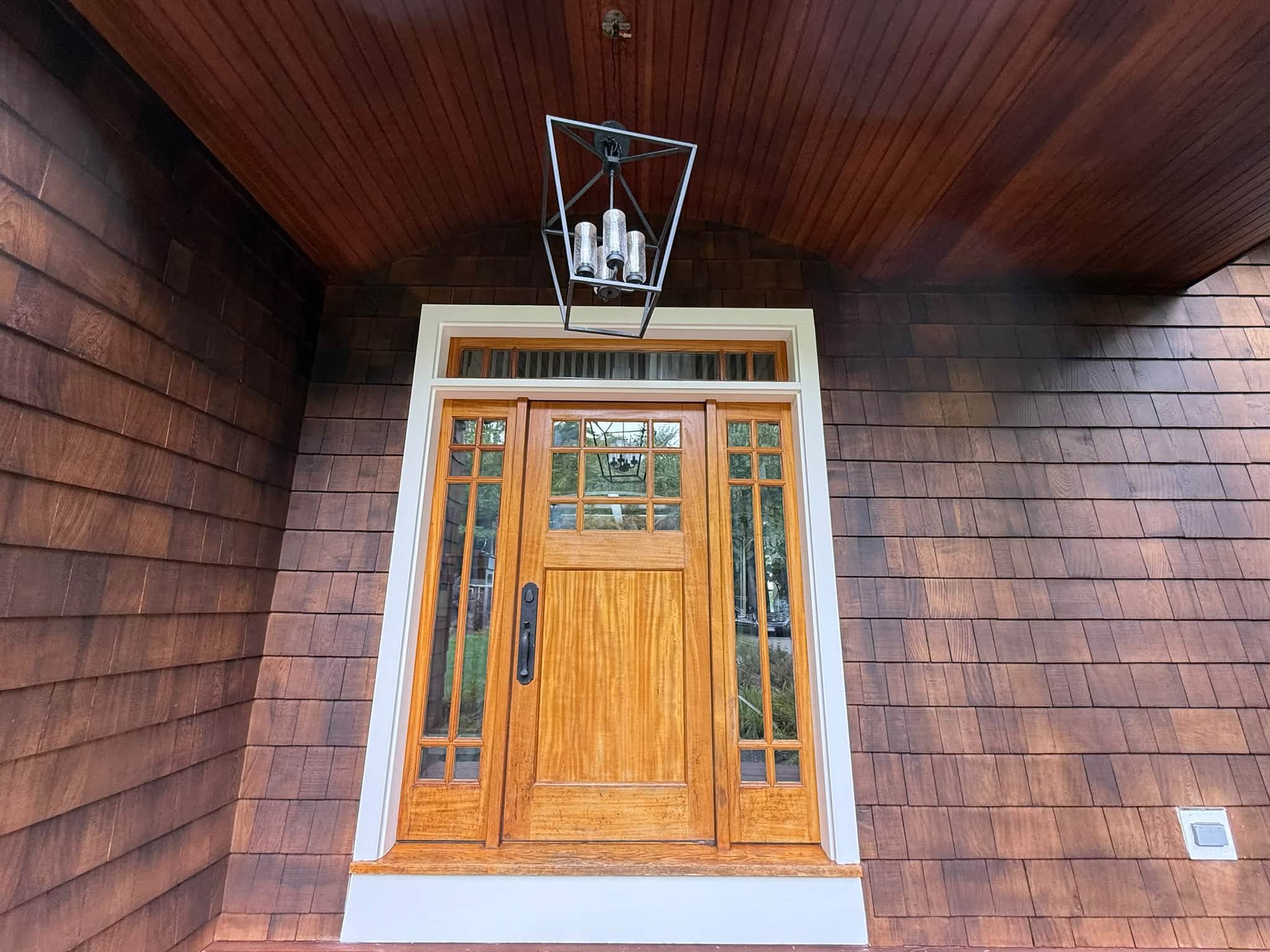 Lakefront Cedar Shingle Restoration — Walnut Stain, Trim & Railings — photo 4